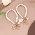 ZAKOL Cute Pearl Keychain for Women Girls Shiny Pearl Bead Shell Phone Bag Backpack Charm Accessory Car Key Key Chain Pendant. 