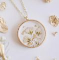 Custom (made to order) pressed flower resin necklaces. 