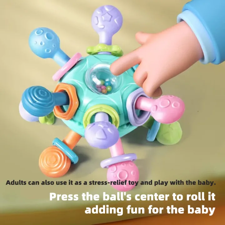 Baby%20Manhattan%20Grasping%20Ball%20-%203-in-1%20Teether,%20Rattle,%20and%20Soft%20Rubber%20Grasping%20Toy%20for%20Early%20Education%20and%20Teething%20Relief%20-%20Image%202