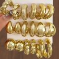 4 peice  Random New Retro Smooth Chunky C Shape Hoop Earrings Glossy Gold Plated Pvd Circle Round Tube Huggie Hoops Stacked Ear Jewelry. 