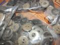 2-hole plastic buttons 100-piece packet. 