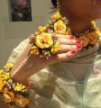Artificial flower bridal jewellery set made with polyster fabric it includes (  earings,ring,tika,bracelet ,necklece). 