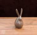 Decoration items (ceramic rabbit figurine showpiece). 