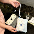 Cute floral sanitary napkin storage bag, female large capacity student portable handheld storage bag for going out. 