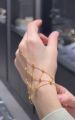 golden finger ring bracelet for women and girls.