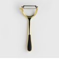 golden potato peeler and vegetable grater. 