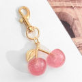 Cherry Keychain Charm Shiny Resin Metal Bag Accessory Elegant for Women Purse or Handbag Decoration.