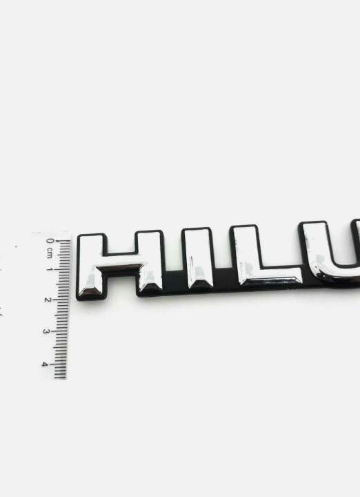 HILUX%20CHROME-BLACK%20LOGO%20EMBLEM%20BADGE%20FOR%20TOYOA%20HILUX%20LN85-106%20MIGHTY-X%20PICKUP%20-%20Image%204
