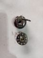 Sewing Machine Bobbin Cover and 2× Bobbin. 
