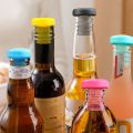 Reusable colorful silicone bottle stoppers, 5 pieces per set, multi-purpose wine bottle sealing caps for home and kitchen use. 