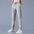 2024 Ice Silk Men's Pants Summer New Black Gray Thin Business Casual Pants Outdoor Elastic Breathable Straight Leg Sweatpants. 