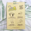 Free dual-sided scrubber + sponge (Scrub Daddy®) White smile face sponge. 