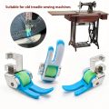 Accessories for old-style household treadle sewing machines: plastic roller presser foot and needle set.