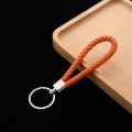 Very cheap 10 colors PU leather fashion keychain woven leather rope keychain bag hanging keychain. 