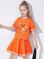 Summer girls' sporty style two-piece set with heart cartoon pattern print, pleated short skirt and short-sleeved T-shirt. 