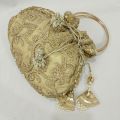 latest potli pouch purse clutch bag with round metal handle. 