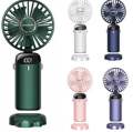 Mini fan for home. Small fan isolated on white background. Portable rechargeable mini fans. Close up.. 