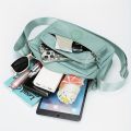 Lightweight Nylon Chic Crossbody Bag for Women - Adjustable Strap, Zip Closure, Tassel Accent, Solid Color.