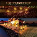 12LED Solar Flame Torch Light Flickering Light Waterproof Garden Decoration Outdoor Lawn Path Yard Patio Floor Lamp. 