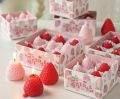 Creative strawberry fruit shaped candles wedding ceremony with hand shooting props decoration. 