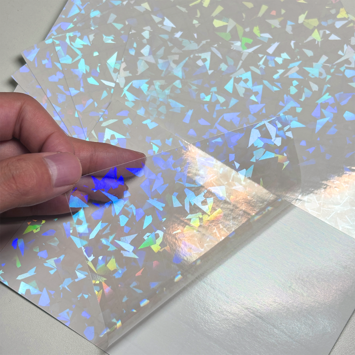 50%20Sheets%20Holographic%20Vinyl%20Sticker%20Paper%20Clear%20A6%20Self%20Adhesive%20Waterproof%20Cold%20Lamination%20Film%20Gem%20Rainbow%20Sand%20Star%20Patterns%20-%20Image%207