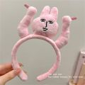 Fun raising hands, pulling hair, pink rabbit headband, funny headband, grabbing bangs, tying hair, cartoon headband. 
