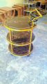 Tea Trolley circular shape golden color three shelf. 