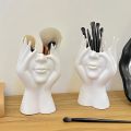 A Creative Face Storage Box – a Desktop Organizer with a Brush Holder for Storing Makeup Brushes Amagi. 