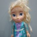 (B). Disney Frozen Snow Glow Elsa Doll Sings "Let it Go" Lights Up 13". 