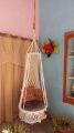 .macrame swing hanging chair in white color. 