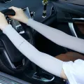 A Pair of Four Colors UV Protection Arm Cooling Sleeves for Outdoor Activities - Stay Cool and Protected from Harmful Sun Rays. 