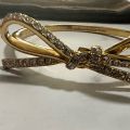 (C). Kate Spade Bow Bangle Bracelet. 
