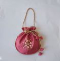 Fancy embroidered clutch/potli bag for wedding parties designer traditional potli gol bag with Handmade Gota work. 
