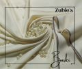 Boski 8 pound cream color unstiched for traditional suitung shalwar and kameez. 