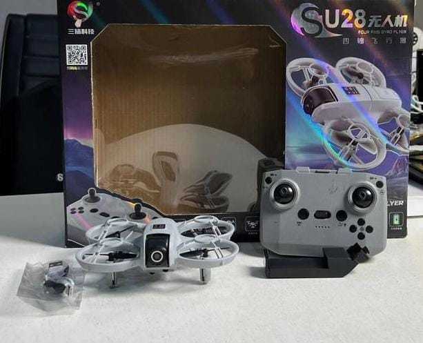 SU28%20Mini%20Drone%20%E2%80%93%202026%20New%20Model%20%7C%20Four%20Axis%20Gyro%20Flyer%20%7C%20Compact%20&%20Fun%20for%20Kids%20&%20Beginners%20%7C%20DJI%20New%20Copy%20Drone%20%7C%20High%20Quality%20Camera%20Drone%20-%20Image%204