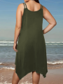 Large women's solid color asymmetrical hem camisole dress. 