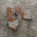 2025 Women Summer Bow Rhinestone Slingback Pumps Fashion Lady Transparent High Heels Sandals Elegant Pointed Toe Heels.