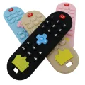 Baby silicone remote control teether baby anti-eating hand teething stick cartoon soothing teething toys cognitive teething toy. 