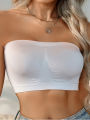 Women's wireless sheer breathable push-up bra - Elegant white strapless design that securely wraps the chest. 