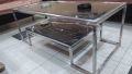 Centre Tabel Stainless Steel Upper Top: 8mm Glass Top With Beveled corners. Lower Top: Marbel Top with Diamond Shape corners. Measurements: Length 48 inches Width 24 inches Height 18 inches. 