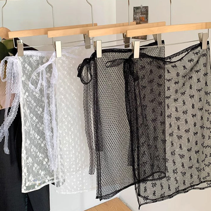 The Lace Dress with a Curtain Cover Creates a Layered Look When Paired with an Apron, a Half Skirt, and a Sheer Floral Pattern