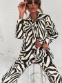 2022 Cross border Hot Edition Street Trendy Print Trouser Set Long Sleeve Full Screen Print Off Shoulder Shirt Set. 