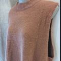 Peach oversized sleeveless body covering sweater. 