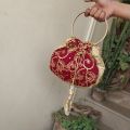 latest potli pouch purse clutch bag with round metal handle. 