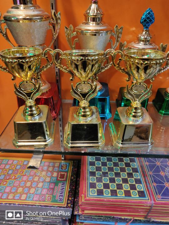 Gold%20Award%20Trophies%20for%20Kids%20-%20Plastic%20Gold%20Trophy%20Cup%20for%20Sports%20Tournament,%20Competition,%20Recognition,%20Prizes%20(pack%20of%203&1)%20-%20Image%203