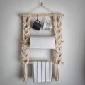 Macrame tissue holder. 