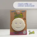 Free dual-sided scrubber + sponge (Scrub Daddy®) White smile face sponge. 