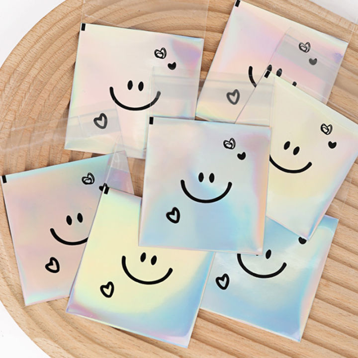 100pcs%20Cute%20Smiling%20Face%20Cookie%20Packaging%20Bag%20Laser%20Transparent%20Biscuit%20Bag%20Self-adhesive%20Bag%20Birthday%20Party%20Wedding%20Decoration%20-%20Image%203