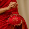 Fancy embroidered clutch/potli bag for wedding parties designer traditional potli gol bag with Handmade Gota work. 