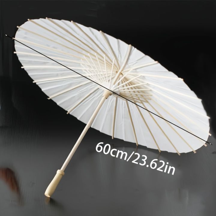 A white paper umbrella for wedding decoration - handmade traditional Chinese bridal sunshade - photo prop and party accessory